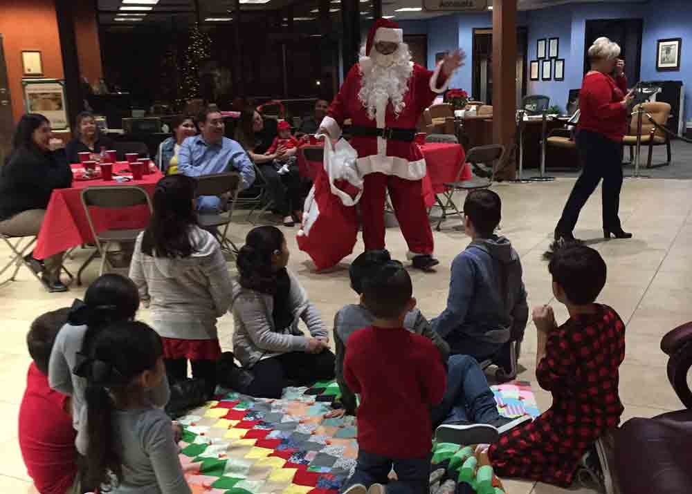 Santa visiting kids at our community event. 